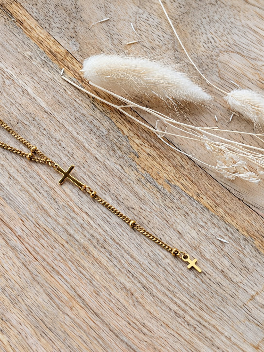 Collier double croix doré à chaîne pendante